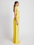 Side full length image of model wearing Matte Crepe Backless Dress in YELLOW