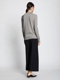 Back full length image of model wearing Eco Superfine Merino Sweater in GREY MELANGE