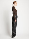 Side full length image of model wearing Faux Leather Drawstring Cargo Pants in BLACK