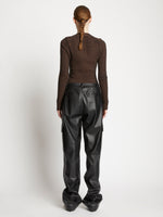 Back full length image of model wearing Faux Leather Drawstring Cargo Pants in BLACK