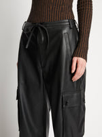 Detail image of model wearing Faux Leather Drawstring Cargo Pants in BLACK
