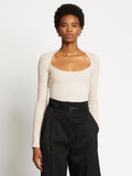Front cropped image of model wearing Plaited Rib Scoop Neck Sweater in BONE/PALE CASHEW