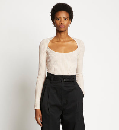Front cropped image of model wearing Plaited Rib Scoop Neck Sweater in BONE/PALE CASHEW