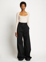 Front full length image of model wearing Plaited Rib Scoop Neck Sweater in BONE/PALE CASHEW