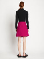 Back full length image of model wearing Tweed Mini Skirt in MAGENTA