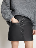 Detail image of model wearing Faux Leather Mini Skirt in BLACK