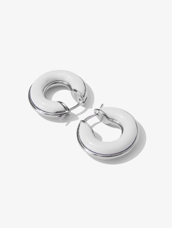 Proenza Schouler Flat lay image of mini hoop earrings in optic white