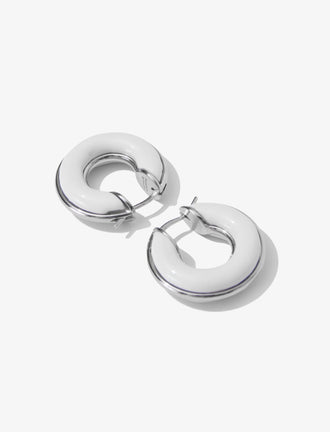 Proenza Schouler Flat lay image of mini hoop earrings in optic white