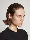 Image of model wearing mini hoop earrings in sulphur