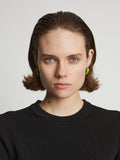 Image of model wearing mini hoop earrings in sulphur