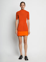 Front full length image of model wearing Compact Viscose Knit Top in TANGERINE