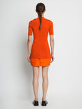 Back full length image of model wearing Compact Viscose Knit Top in TANGERINE