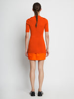 Back full length image of model wearing Compact Viscose Knit Top in TANGERINE