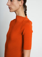 Detail image of model wearing Compact Viscose Knit Top in TANGERINE