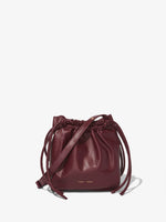 Front image of Drawstring Pouch in DARK RED with straps down