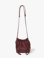 Front image of Drawstring Pouch in DARK RED with straps extended