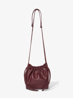 Back image of Drawstring Pouch in DARK RED with straps extended