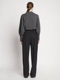 Back full length image of model wearing Eco Cashmere Balloon Sleeve Sweater in GREY MELANGE
