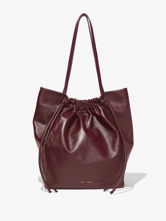 Front image of Drawstring Tote in DARK RED