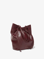 Side image of Drawstring Tote in DARK RED with straps down