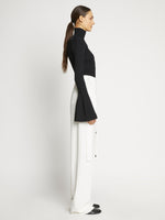Proenza Schouler side image of model wearing Viscose Rib Zip Sweater in black