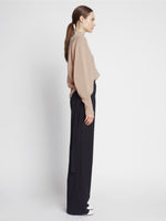 Side image of model wearing Eco Cashmere Balloon Sleeve Sweater in OATMEAL