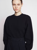Detail image of model wearing balloon sleeve cashmere jumper in BLACK