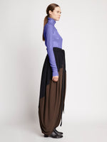 Side full length image of model wearing Faceted Sequin Top in LILAC