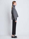 Side image of model wearing Doubleface Eco Cashmere Oversized Turtleneck Sweater in GREY MELANGE