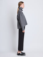 Side image of model wearing Doubleface Eco Cashmere Oversized Turtleneck Sweater in GREY MELANGE