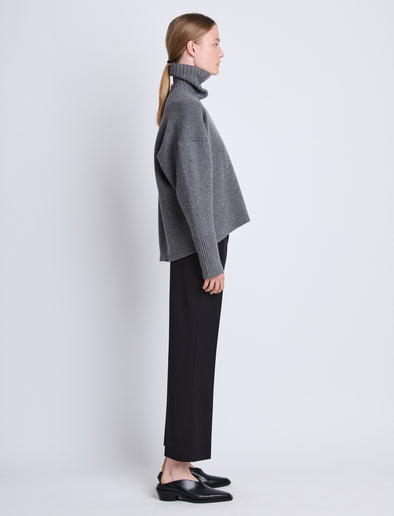 Side image of model wearing Doubleface Eco Cashmere Oversized Turtleneck Sweater in GREY MELANGE