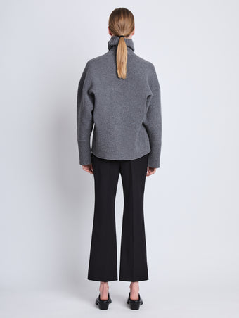 Back image of model wearing Doubleface Eco Cashmere Oversized Turtleneck Sweater in GREY MELANGE