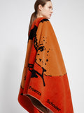 Image of model wearing Orange Beach Towel in LIGHT RED/ORANGE/BLACK