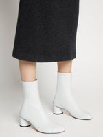 Image of model wearing Sculpt Ankle Boots in White