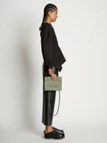 Image of model wearing Accordion Flap Bag in ARTICHOKE