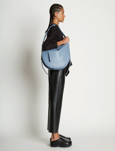 Image of model wearing Baxter Leather Bag in DOVE GREY