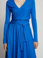 Detail image of model wearing Matte Crepe Wrap Dress in BRIGHT BLUE