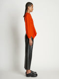 Side full length image of model wearing V-Neck Poplin Top in CHERRY