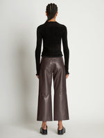 Back full length image of model wearing Cropped Turtleneck Chenille Sweater in BLACK