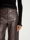 Detail image of model wearing Cropped Turtleneck Chenille Sweater in BLACK