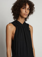 Detail image of model wearing Pleatable Crepe Drawstring Dress in BLACK