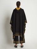 Side full length image of model wearing Cashmere Blend Poncho in BLACK/DARK SAND