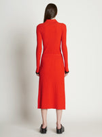 Back full length image of model wearing Rib Knit Button Front Skirt in VERMILLION