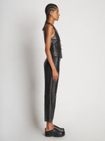 Side full length image of model wearing Leather Vest in BLACK