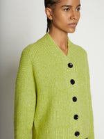 Detail image of model wearing Fluffy Knit Cardigan in AVOCADO/HONEYDEW