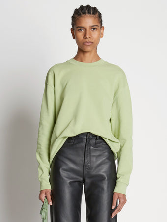 Front cropped image of model wearing Long Sleeve Sweatshirt in GREEN TEA