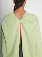 Detail image of model wearing Long Sleeve Sweatshirt in GREEN TEA