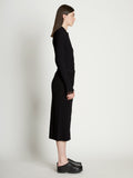 Side full length image of model wearing Rib Knit Button Front Skirt in BLACK