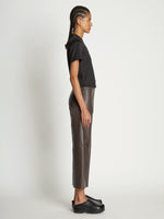 Side full length image of model wearing Scuba Short Sleeve Shirt in BLACK