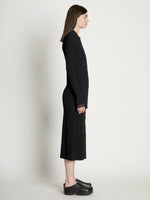 Side full length image of model wearing Rib Knit Fitted Cardigan in BLACK